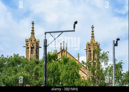 Two CCTV security cameras beside a church, Glasgow, Scotland, UK, Europe Stock Photo