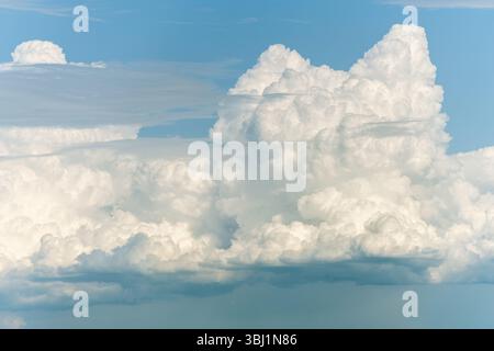 A large cloud in the sky. The sky is blue. The cloud is white.Bas rhin, alsace, grand est, France, Europe.. Stock Photo