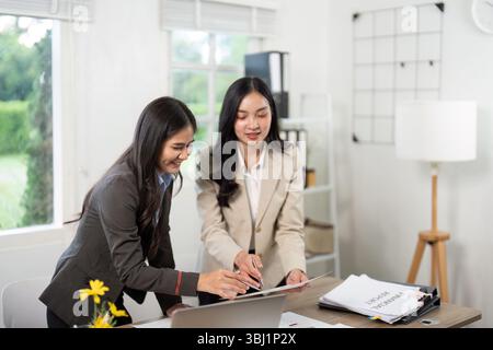 Collaborative Workspace with Business Professionals. Team analyzing reports and strategies. Stock Photo