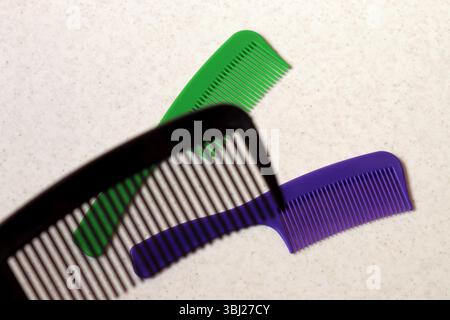 Image of colored combs for hair on a light background. Stock Photo