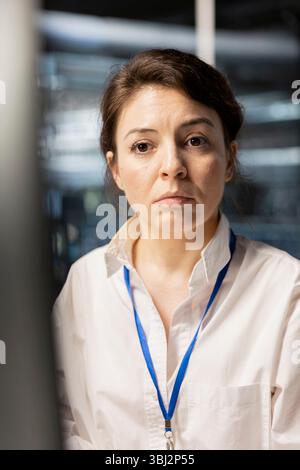 Data center software developer analyzing program logs metrics, optimizing storage systems. Close up of server hub IT specialist inspecting resource utilization, managing application efficiency Stock Photo