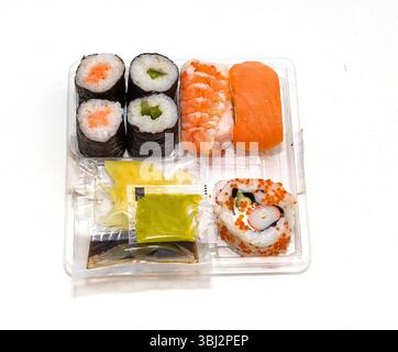 Take away sushi assortment with condiments in plastic box Stock Photo
