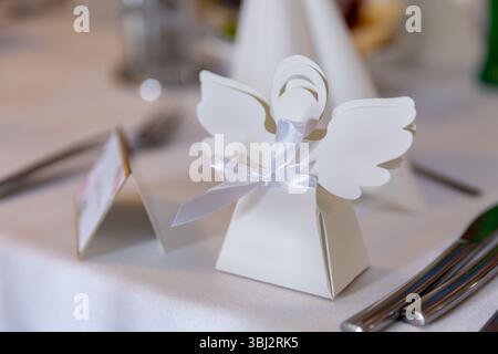 Discover Elegant Wedding Table Decor with a Beautiful Angel Place Card Holder for your day Stock Photo