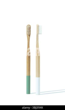 Two wooden toothbrushes on a white background for eco-friendly oral care Stock Photo