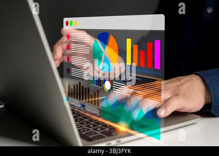 Modern business data analytics interface on laptop screen with futuristic UI, featuring pie chart, bar graph, and financial visualization for marketin Stock Photo
