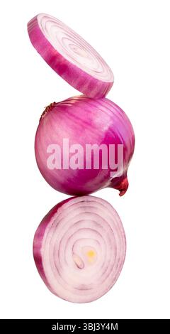 Single fresh peeled red or purple Spanish onion bulb with two onion slices in circles in stack is isolated on white background with clipping path. Stock Photo
