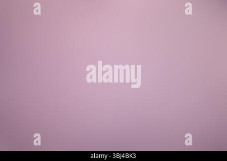 This image features a closeup view of a beautiful pink background that has a lovely gradient effect incorporated into it Stock Photo