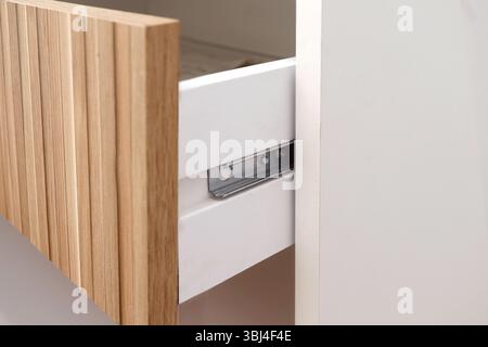 detail of metal drawer slide Stock Photo