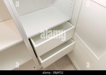 empty drawers and metal accessory for white cabinet interiors Stock Photo