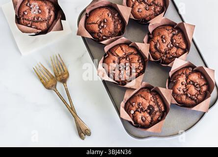 Chocolate Muffins with Chocolate Chips in a Baking Tray Top Down Photo Stock Photo