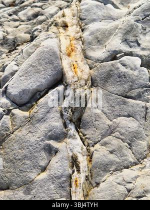 Broken stone texture. slate veins in stone. unusual stone. slate inclusions. Stock Photo