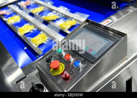 Control panel of industrial machine are wrap food products food in production lines, food production industry Stock Photo