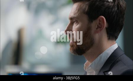 Busy serious Caucasian middle-aged man businessman working computer desk pc project online job typing keyboard concentrated male guy business manager Stock Photo