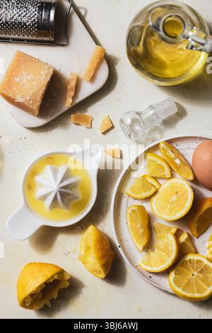 Juiced lemons, cheese, and oil arranged for citrus-based recipe-2.jpg Stock Photo