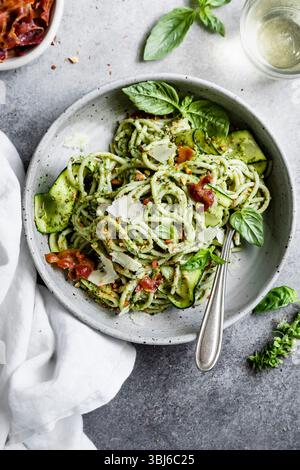 Appetizing spaghetti pasta dish with crispy bacon and fresh basil