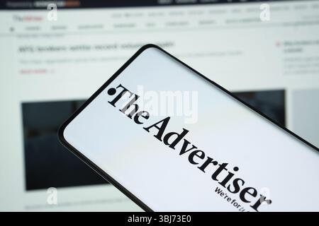 Dhaka, Bangladesh - 18 March 2025: The logo of the advertiser is displayed on a smartphone screen and the website is visible on a computer screen in t Stock Photo