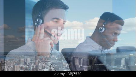 Operating monitors, two call center agents wearing business shirts in office at desks with headsets Stock Photo