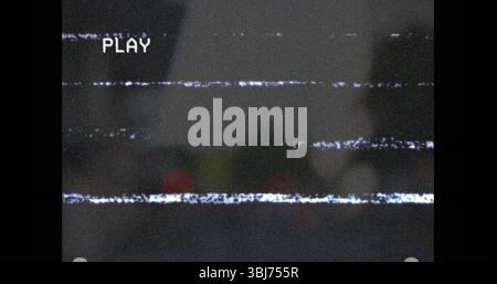 Displaying PLAY overlay text over glitchy static interference lines on screen interface Stock Photo