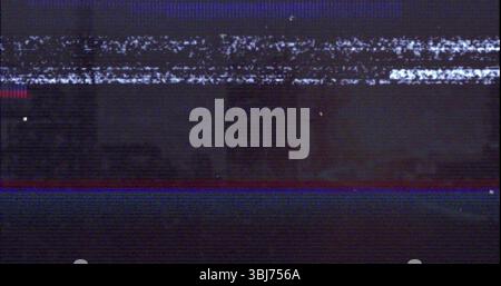 Flickering glitchy analog static filling vintage TV screen, showing red and blue glitch lines Stock Photo
