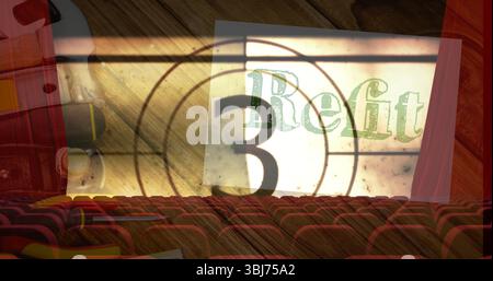 Showing vintage countdown number three Refit on screen at cinema with red seats and projector Stock Photo