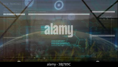 Displaying holographic terminal interface in grass field, showing code windows and HUD graphics Stock Photo