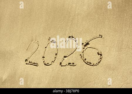 Happy New Year 2026. The number 2026 written on the beach. . High quality photo Stock Photo