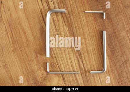 Combination hex wrench Steel. Working tools on wooden background. repair, construction Stock Photo