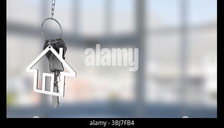 Displaying silver keyring holding house keychain and two keys in empty room, with diffused light Stock Photo