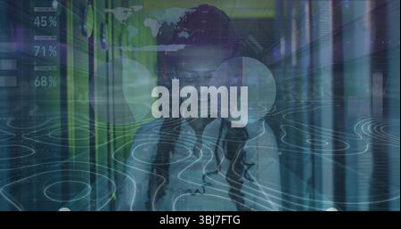 Monitoring woman IT technician in shirt checking tablet in server rack aisle, with HUD overlays Stock Photo