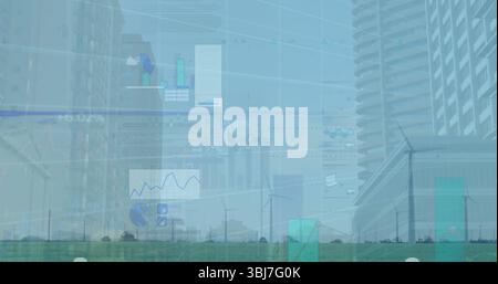 Displaying semi transparent charts overlaying wind turbines on grassland, urban skyline background Stock Photo