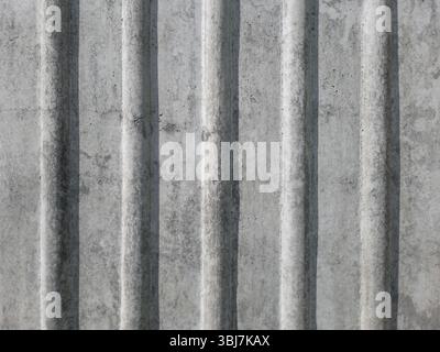 Ribbed concrete wall with vertical stripes. Textured background. Stock Photo