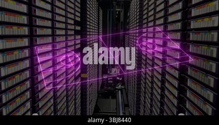Projecting purple holographic soccer pitch across archive aisle, with cartridges and retrieval unit Stock Photo