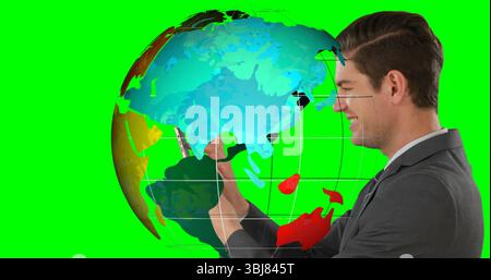 Manipulating businessman holding smartphone in green screen, with digital globe overlay, copy space Stock Photo