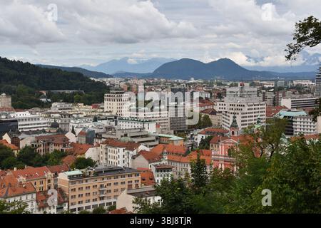 Ljublana city view and mountains under cloudy skies Stock Photo