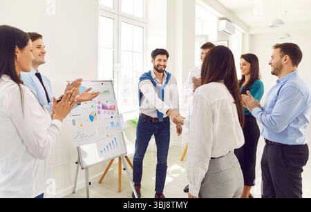 Professional male leader presenter gives business presentation at office conference meeting Stock Photo