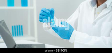 Scientist analyze biochemical sample in advanced scientific laboratory. Medical professional check chemical mix microbiological developmental of viral Stock Photo