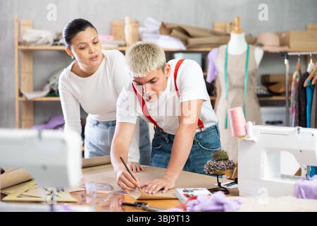 team of tailors working in a workshop Stock Photo
