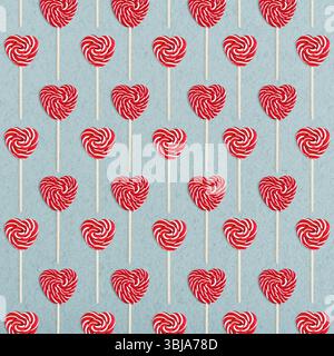 Pattern from heart lollipops candy on a stick on blue background  top view, Valentine's day concept. Stock Photo