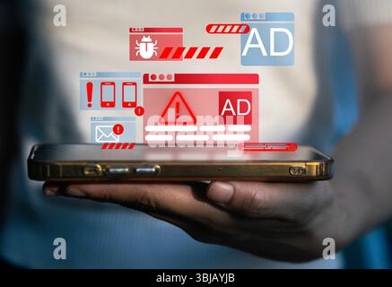 Digital warning signs and alert icons displayed on a tablet screen with a hand interacting, futuristic creative background, concept of cybersecurity a Stock Photo