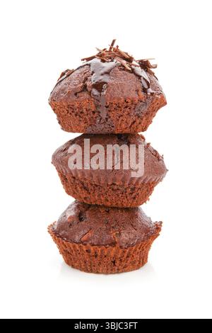 Three delicious chocolate muffins arranged on each other isolated on white background Stock Photo