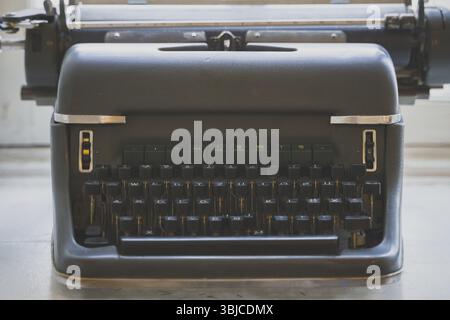 Old retro typewriter standing on the windowsill Stock Photo