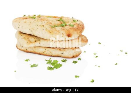 Garlic and coriander naan bread with fresh herbs and garlic isolated on white background. Culinary eastern cuisine Stock Photo