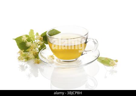 Cup of healthy herbal linden tea with linden flowers . Isolated on white background Stock Photo