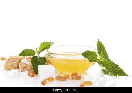 Various types of sugar - brown sugar, white sugar, crystal sugar, artificial sweetener, cane sugar, powdered sugar. Honey in bowl Stock Photo