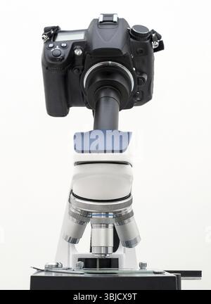 DSLR Camera attached with adapter to microscope Stock Photo
