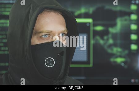 Hacker in black mask. Hacking and internet security concept Stock Photo