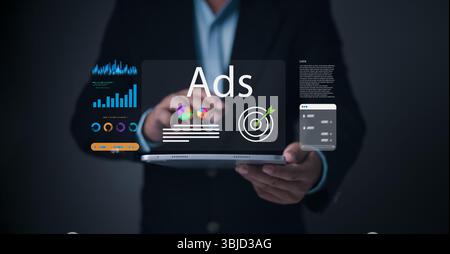 A businessman interacts with a digital tablet displaying targeted ads, colorful marketing graphs, performance analytics, and advertising dashboard UI Stock Photo