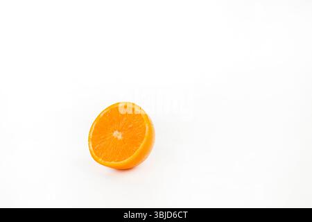 Half orange isolated on white background with space for text. Stock Photo