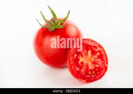 Fresh red tomatoes isolated on white background. Stock Photo