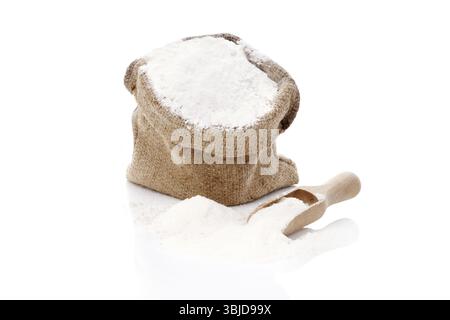 Flour in brown burlap sack isolated on white background. Bread making concept Stock Photo